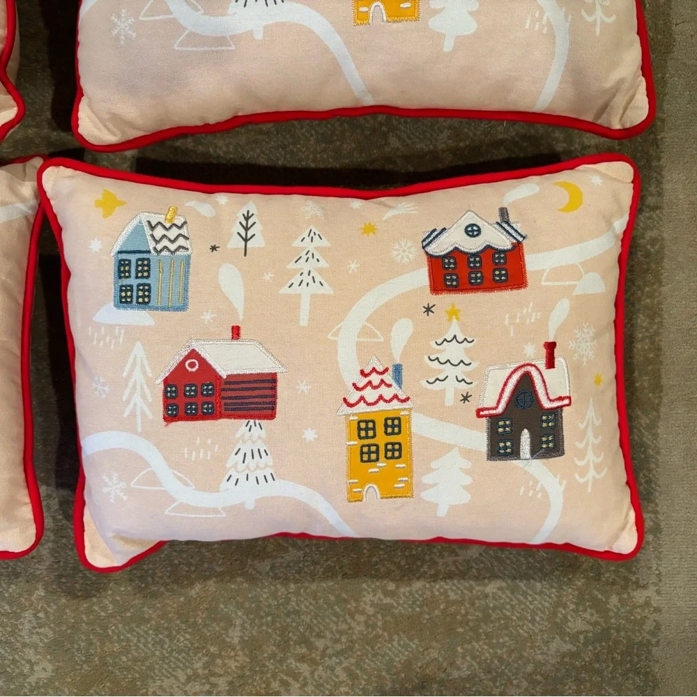 Christmas holiday throw pillows winter village houses. Red trim.